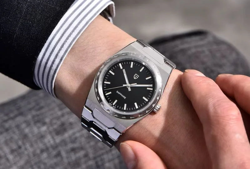 Royal Slim dress watch on a wrist, emerging from a striped shirt cuff under a suit