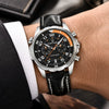 Man in a suit wearing the black Aero Chronograph watch by Pagani Design on a black leather strap