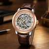 Artisan Open Dial de oro rosa de Pagani Design sobre un escritorio junto a una pluma estilográfica