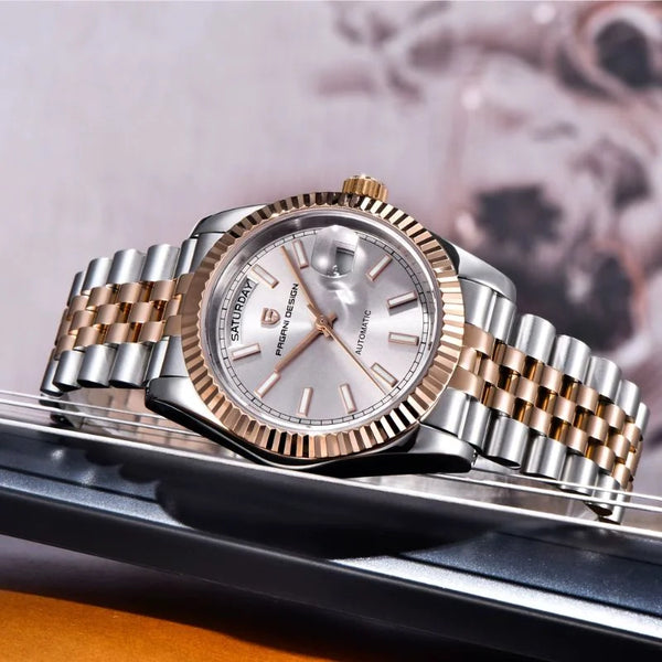 Silver-dial Aurelia by Pagani Design on a dark tray against an orange background
