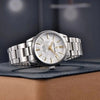 White-dial Aurum Frost by Pagani Design resting on a leather goods display