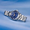 Blue-dial Aurum Frost by Pagani Design lying on a blue gradient backdrop