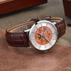 Copper Moon watch by Pagani Design lying on a tan leather surface inside its case