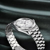 Silver Prestige Edition by Pagani Design angled on green silk fabric