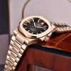 Black-dial Rose Horizon by Pagani Design angled over the edge of a wooden table