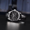 Steel Vanguard Classic with black dial by Pagani Design on a dark desk